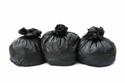 Clearance crew assessing rubbish volume for an Acton home or flat