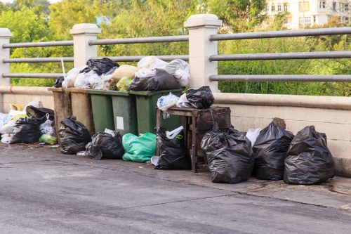 Rubbish clearance team loading waste into a vehicle