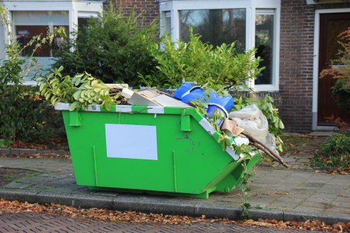 Clearance crew handling household and office rubbish in Acton