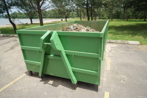 Clearance crew managing collected waste during a removal job